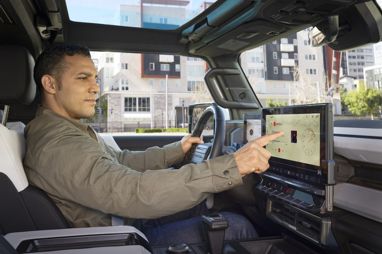 Man Using Infotainment System in Vehicle