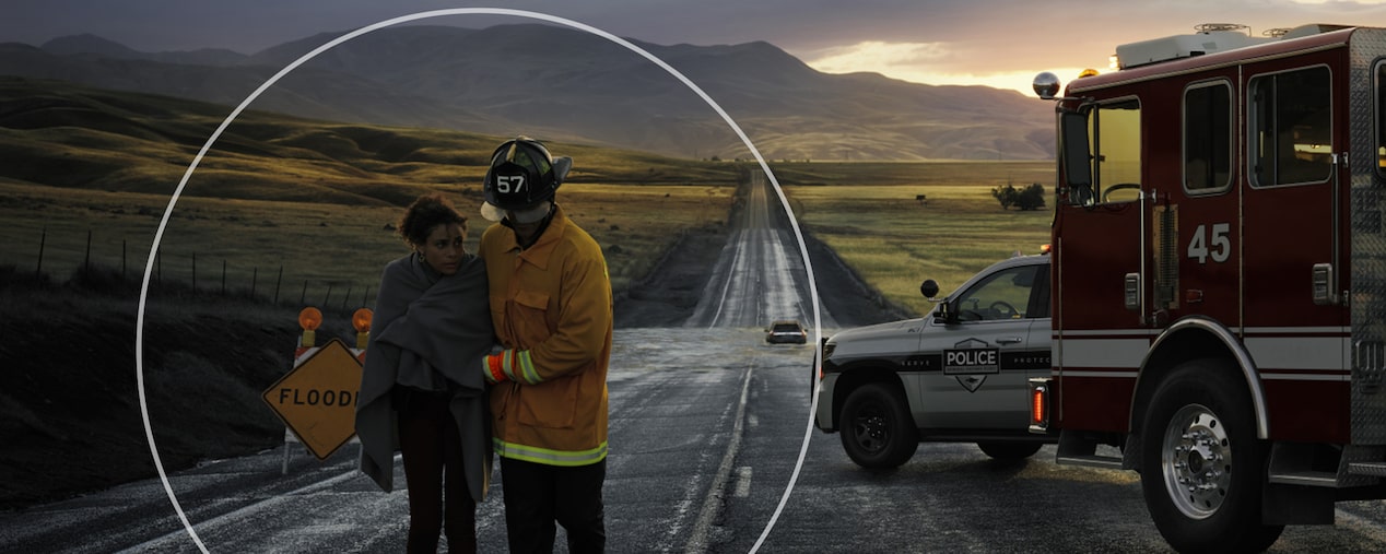 Firefighter Walking Victim Away From a Crash Scene 