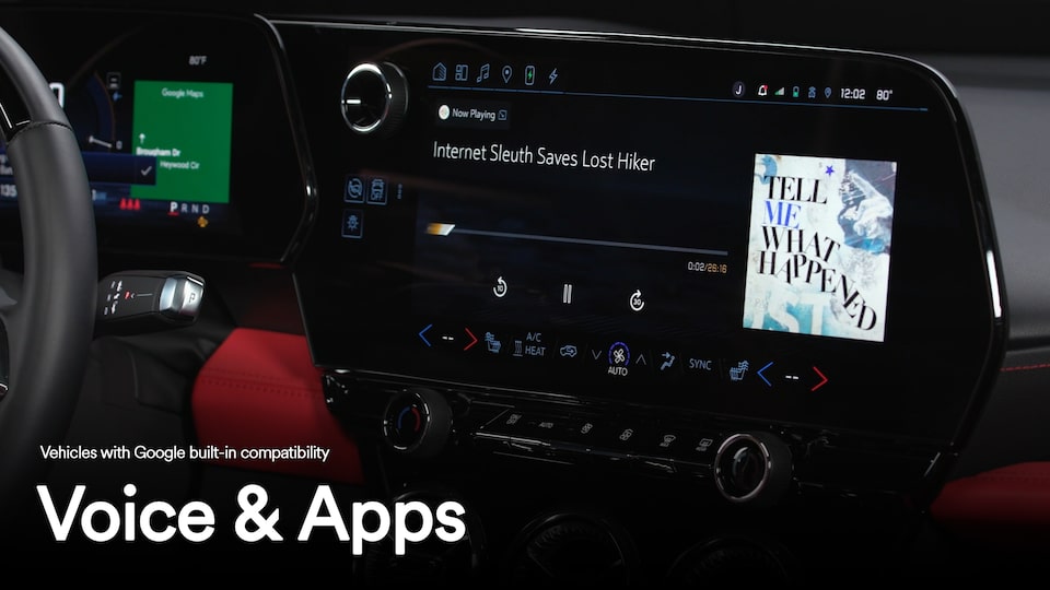 Close-up of the infotainment screen displaying a song playing with text overlay "Voice and Apps"