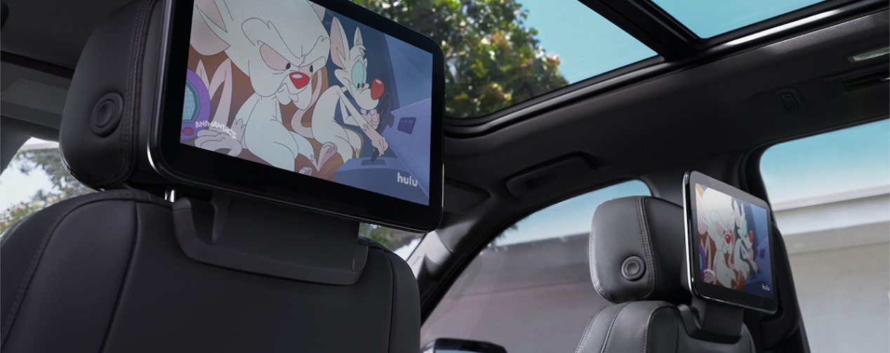 Close-up of TV Screens on the Back of Front Seat Headrests