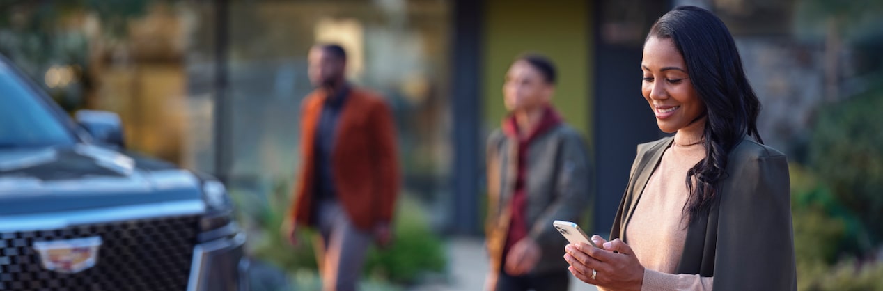 Woman Smiling Using Smartphone