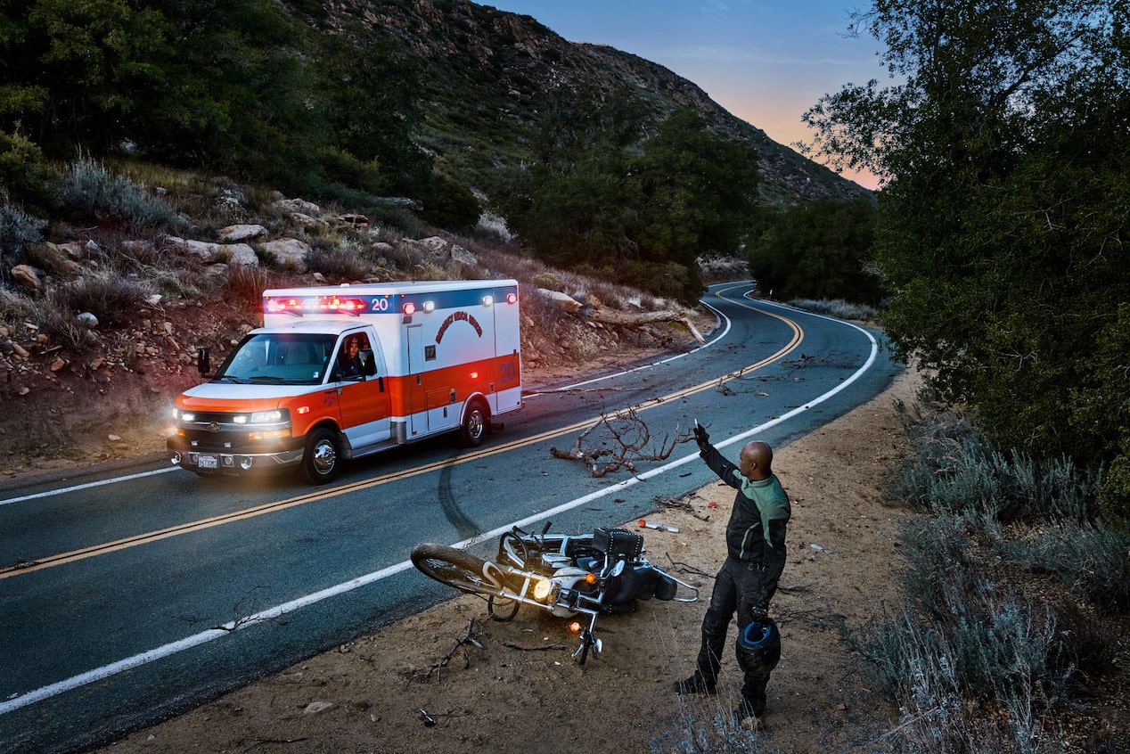 EMT Raises His Hand at Ambulance While Helping Victim