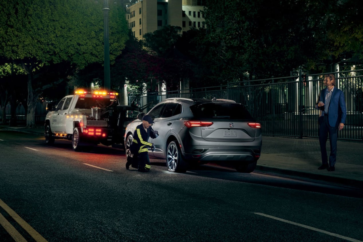 Roadside Assistance Worker Assisting Vehicle on the Side of the Road