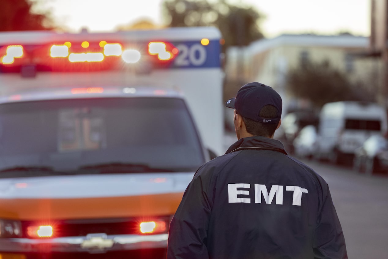 EMT Walking Towards the Drivers Side of His Ambulance 