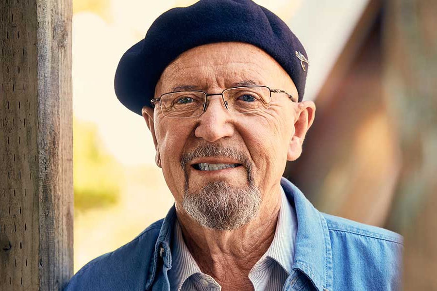 Older Man Wearing Beret Hat and Smiling