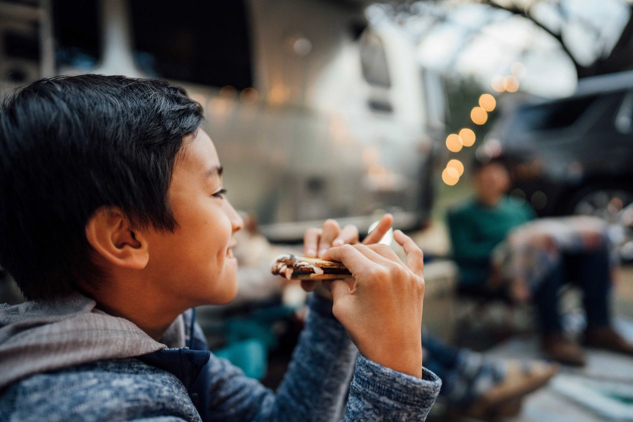 Little Boy Smiling Eating a S'more