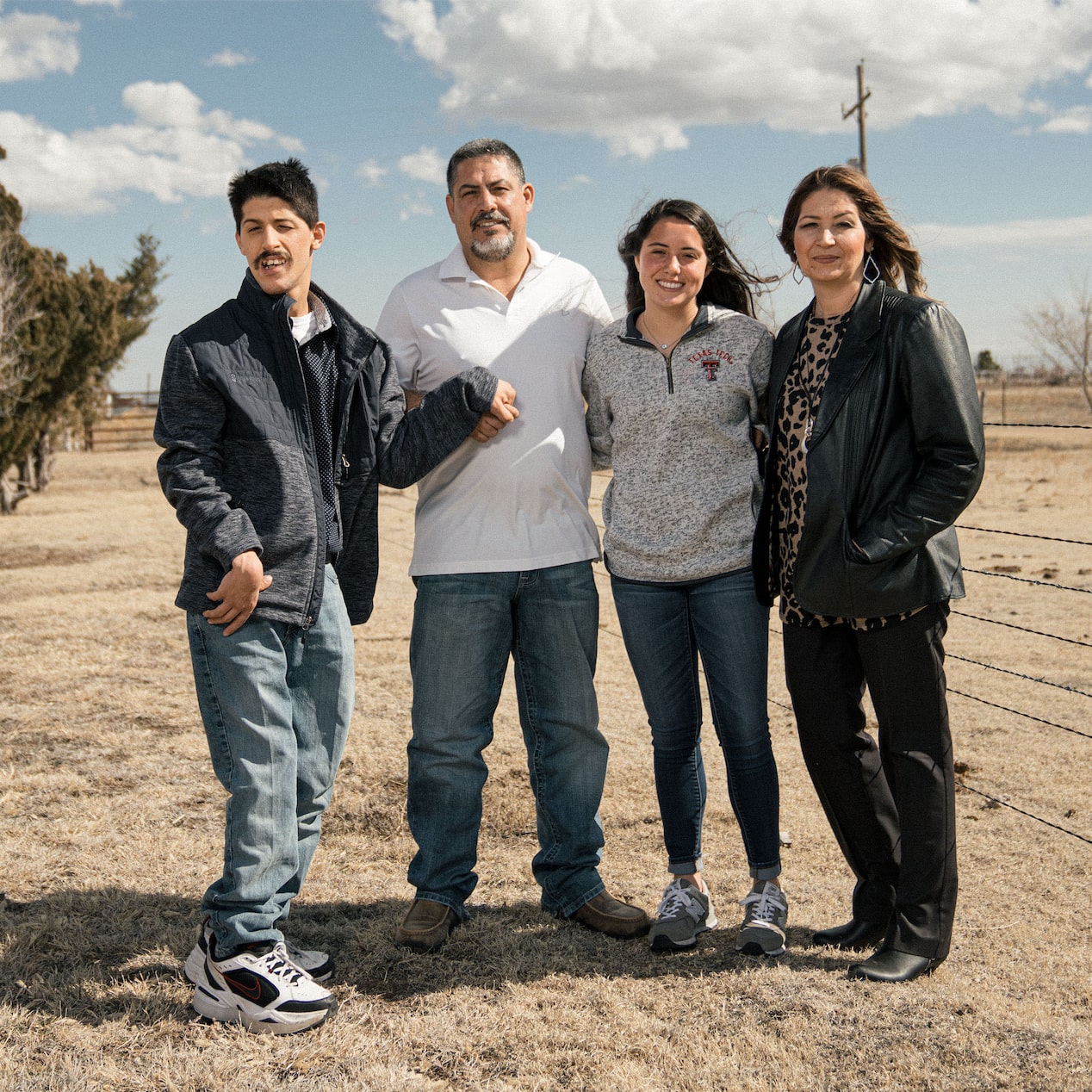 Family of Four Posing Together for a Picture