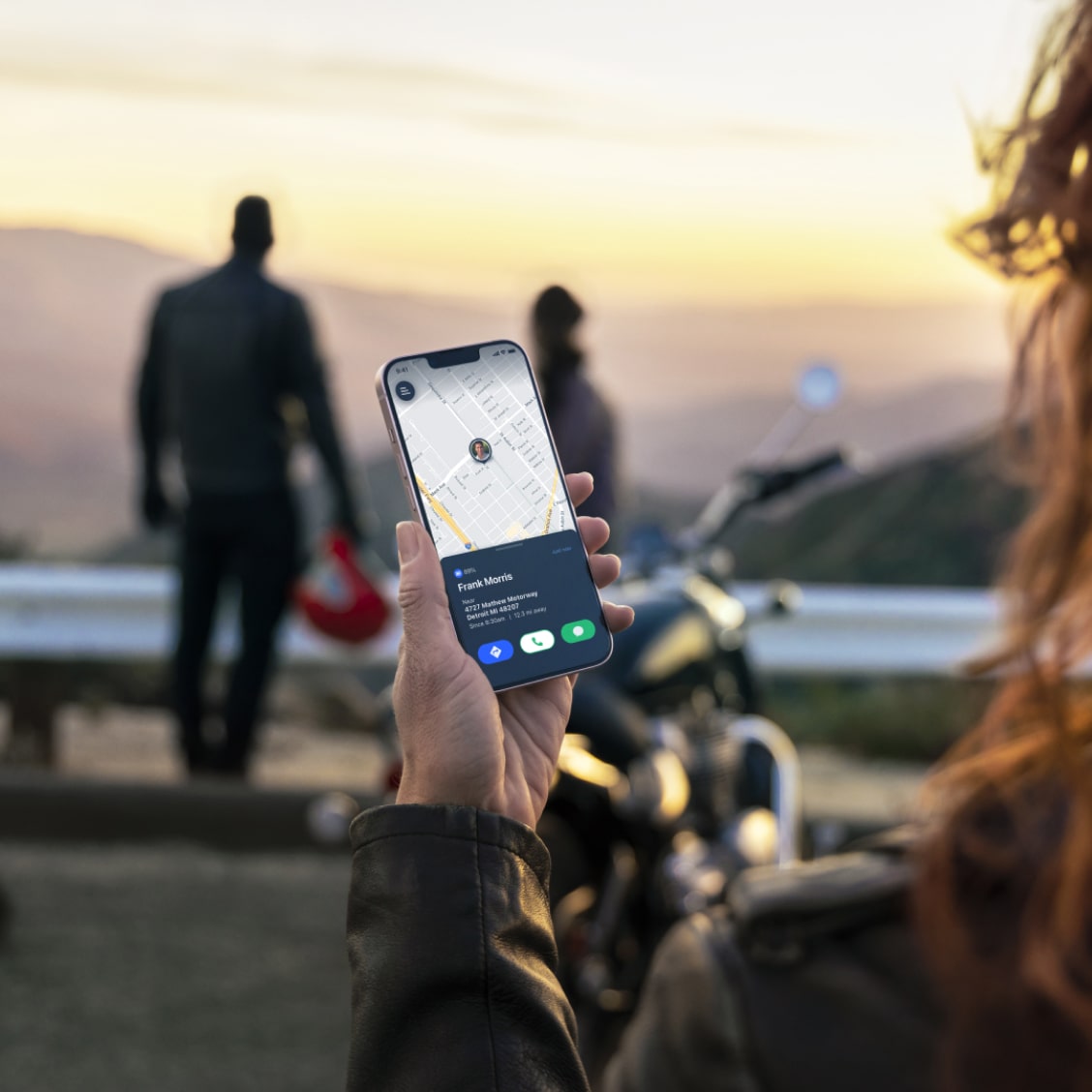 Woman Looking at Phone at Road Overlook