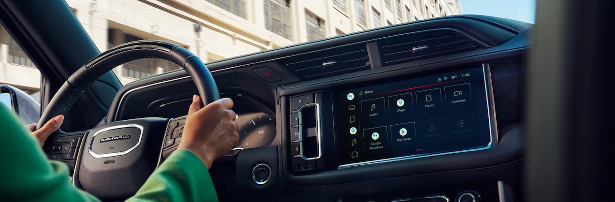 View of a vehicle's steering wheel and infotainment system